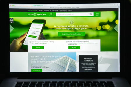 Milan, Italy - August 10, 2017: Intesa Sanpaolo bank website homepage. It is a banking group resulting from the merger between Banca Intesa and Sanpaolo IMI . Intesa Sanpaolo bank logo visible.のeditorial素材