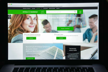 Milan, Italy - August 10, 2017: Intesa Sanpaolo bank website homepage. It is a banking group resulting from the merger between Banca Intesa and Sanpaolo IMI . Intesa Sanpaolo bank logo visible.のeditorial素材