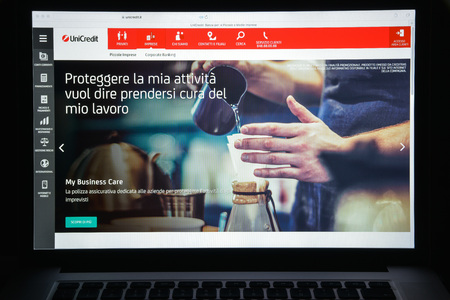 Milan, Italy - August 10, 2017: Unicredit bank website homepage. It s an Italian global banking and financial services company. Unicredit bank logo visible.のeditorial素材
