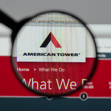 Milan, Italy - August 10, 2017: American Tower website homepage. It is a publicly held company, owner and operator of wireless and broadcast communications. American Tower logo visible.のeditorial素材