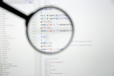 Real c  c code developing screen. Programing workflow abstract algorithm concept. Lines of c  c code visible under magnifying lens.の写真素材