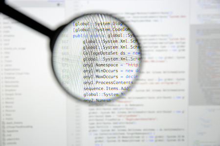 Real c code developing screen. Programing workflow abstract algorithm concept. Lines of c code visible under magnifying lens.の写真素材
