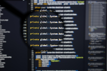 Real c code developing screen. Programing workflow abstract algorithm concept. Lines of c code visible under magnifying lens.の写真素材