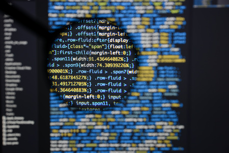 Real css code developing screen. Programing workflow abstract algorithm concept. Lines of css code visible under magnifying lens.の写真素材