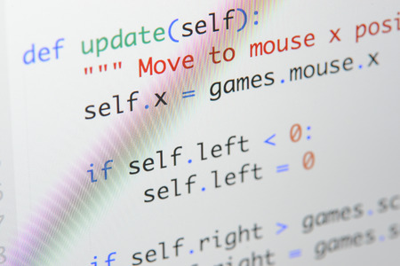 Real Python code developing screen. Programing workflow abstract algorithm concept. Lines of Python code visible under magnifying lens.の写真素材