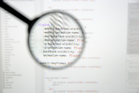 Real css code developing screen. Programing workflow abstract algorithm concept. Lines of css code visible under magnifying lens.の写真素材