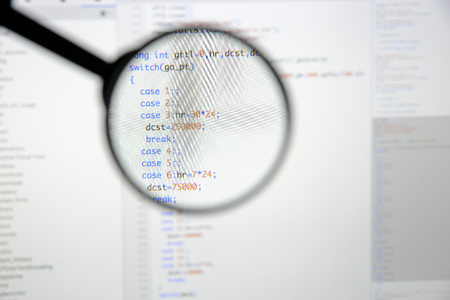 Real c / c++ code developing screen. Programing workflow abstract algorithm concept. Lines of c / c++ code visible under magnifying lens.の写真素材