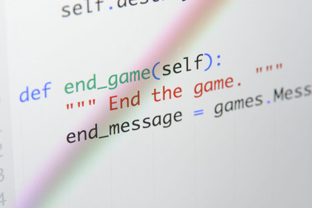 Real Python code developing screen. Programing workflow abstract algorithm concept. Lines of Python code visible under magnifying lens.の写真素材