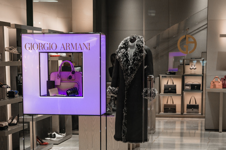 Milan, Italy - October 9, 2016: Shop window of a Giorgio Armani shop in Milan - Galleria Vittorio Emanuele II, Italy. Few days after Milan Fashion Week. Fall Winter 2017 Collection. Brand of Armani fashion house founded in 1975 by Giorgio Armani. The fastのeditorial素材