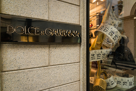 Milan, Italy - October 9, 2016: Shop window and entrance of a Dolce & Gabbana shop in Milan - Montenapoleone street, Italy. Few days after Milan Fashion Week. Fall Winter 2017 Collection.のeditorial素材