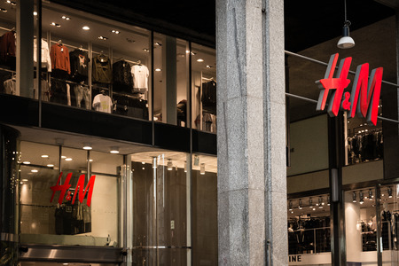 Milan, Italy - October 9, 2016: Shop window and entrance of a H&M shop in Milan, Italy. Few days after Milan Fashion Week. Fall Winter 2017 Collection.のeditorial素材