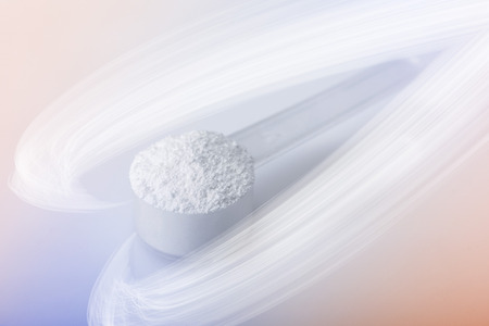 Power of Meds. Sport supplement, drug, creatine, hmb, bcaa, amino acid or vitamin mesure with powder. Sport nutrition concept.の写真素材