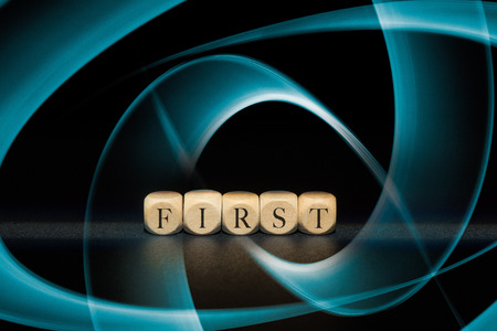 First word on wooden cubes. First conceptの写真素材