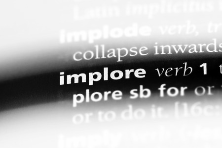 implore word in a dictionary. implore concept.の写真素材