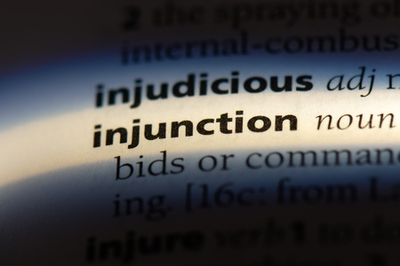 injunction word in a dictionary. injunction concept.の写真素材