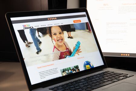 Milan, Italy - August 15, 2018: Saude Crianca (Brazil Child Health) NGO website homepage. Saude Crianca (Brazil Child Health) logo visible.のeditorial素材