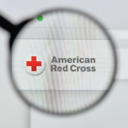 Milan, Italy - August 20, 2018: Red Cross website homepage. Red Cross logo visible.のeditorial素材
