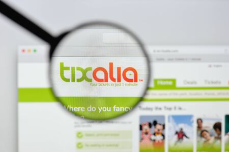 Milan, Italy - August 20, 2018: Tixalia Worldwide website homepage. Tixalia Worldwide logo visible.のeditorial素材