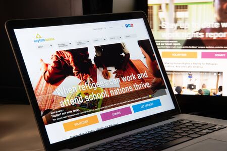 Milan, Italy - August 15, 2018: Asylum Access NGO website homepage. Asylum Access logo visible.のeditorial素材