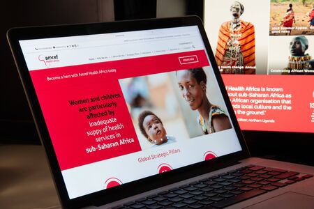 Milan, Italy - August 15, 2018: AMREF NGO website homepage. AMREF logo visible.のeditorial素材