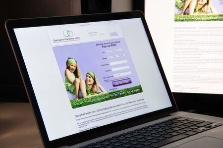 Milan, Italy - August 15, 2018: dating for parents website homepage. dating for parents logo visible.のeditorial素材