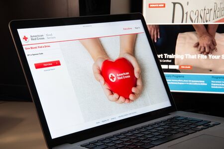 Milan, Italy - August 15, 2018: Red Cross NGO website homepage. Red Cross logo visible.のeditorial素材