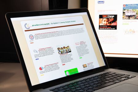 Milan, Italy - August 15, 2018: Population and Community Development Association NGO website homepage. Population and Community Development Association logo visible.のeditorial素材