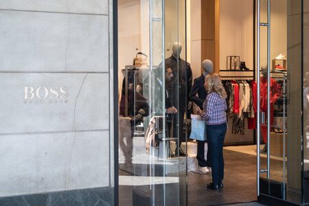 Milan, Italy â September 21, 2019: Hugo Boss store in Milan. Montenapoleone area. Fashion week shoppingのeditorial素材