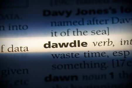dawdle word in a dictionary. dawdle concept, definition.の写真素材