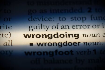 wrongdoing word in a dictionary. wrongdoing concept, definition.の写真素材