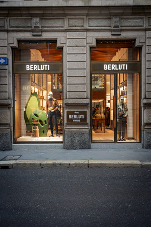 Milan, Italy - 2026, 3 Feb: Berluti FW25 store window features elegant menswear, modern design, and...