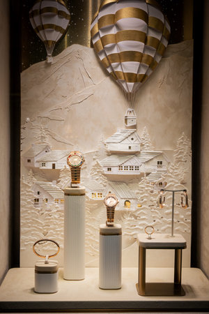 Milan, Italy - 2026, 3 Feb: Elegant Chopard FW25 fashion store window featuring luxury watches, gold...
