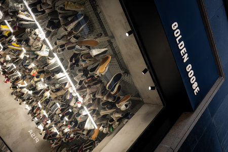 Milan, Italy - 2026, 3 Feb: Golden Goose FW25 sneaker display features a striking, illuminated...