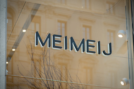 Milan, Italy - 2026, 3 Feb: Meimeij FW25 boutique window with modern branding and stylish...