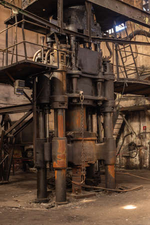 Abandoned industrial power plant. Old rusty iron machinery and equipment.の写真素材