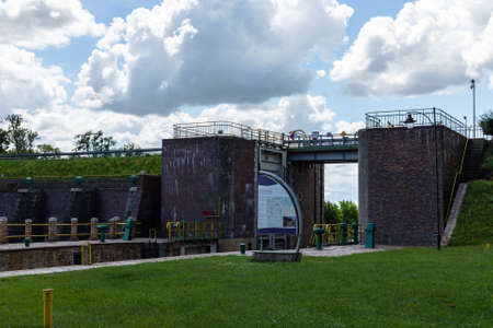 The entrance to the water gate to the river Elbe in the Netherlandsの写真素材