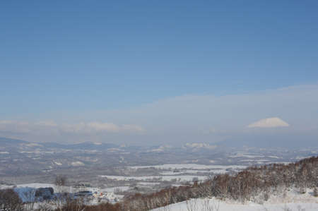 Winter snow landscape with snow-clad volcano in Hokkaido, Japanの写真素材