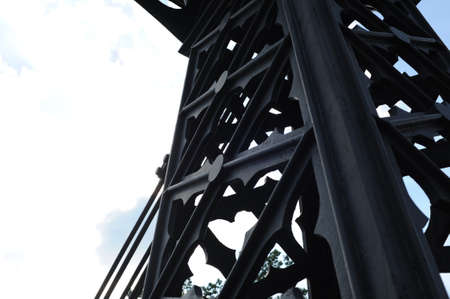 THE OLDEST SURVIVING IRON SUSPENSION CHAIN BRIDGE IN EUROPE ON THE MAÅA PANEW RIVER IN THE CITY OF OZIMEK IN SOUTHERN POLAND WITH a chain structure suspended on openwork cast iron pylonsの写真素材