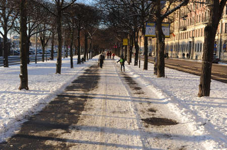 Sunset time view of Stockholm the capital of Sweden in winter with blue sky and white snow at late afternoonの写真素材