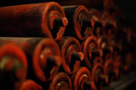 Old steel and iron heavy industrial metal parts and gear in an old factory or workshop for vintage technology used in metallurgy and metalworking and machine productionの写真素材