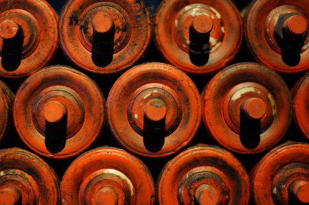 Old steel and iron heavy industrial metal parts and gear in an old factory or workshop for vintage technology used in metallurgy and metalworking and machine productionの写真素材
