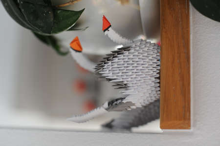 3D modular origami paper swan handmade with white paper - an example of craftwork and handwork requiring craftsmanshipの写真素材