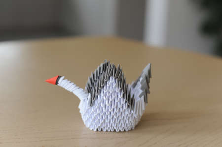 3D modular origami paper swan handmade with white paper - an example of craftwork and handwork requiring craftsmanshipの写真素材