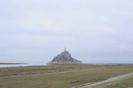 Mont-saint-michel historic fortress town with cathedral on a rock island in autumn in Normandy, Franceのeditorial素材