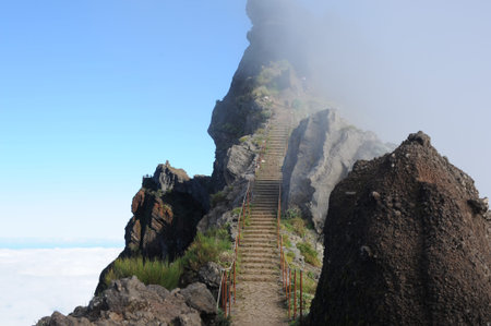 Pico do Areeiro with stone stairs perfect for hiking, third highest mountain peak on Madeira island,...