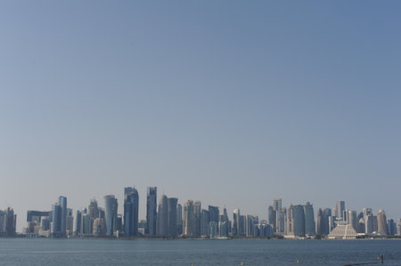 Panoramic view of modern skyscrapers of Doha capital city cityscape on a sunny day in summer, Doha, Qatarの写真素材