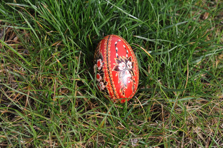 Traditional hand-dyed and hand-painted Easter eggs on the green grass in Poland called pisanka or kroszonka or kraszonkaの写真素材