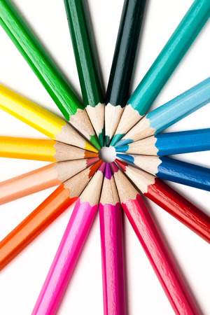 Colored pencils arranged in the shape of the sunの写真素材