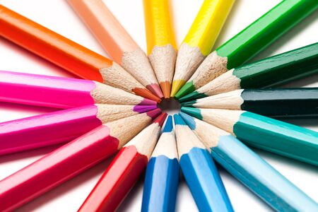 Colored pencils arranged in the shape of the sunの写真素材