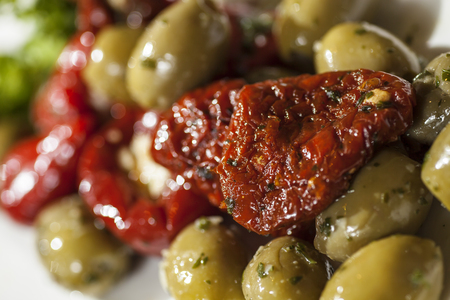 Olive salad, dried tomatoes and grilled peppersの写真素材